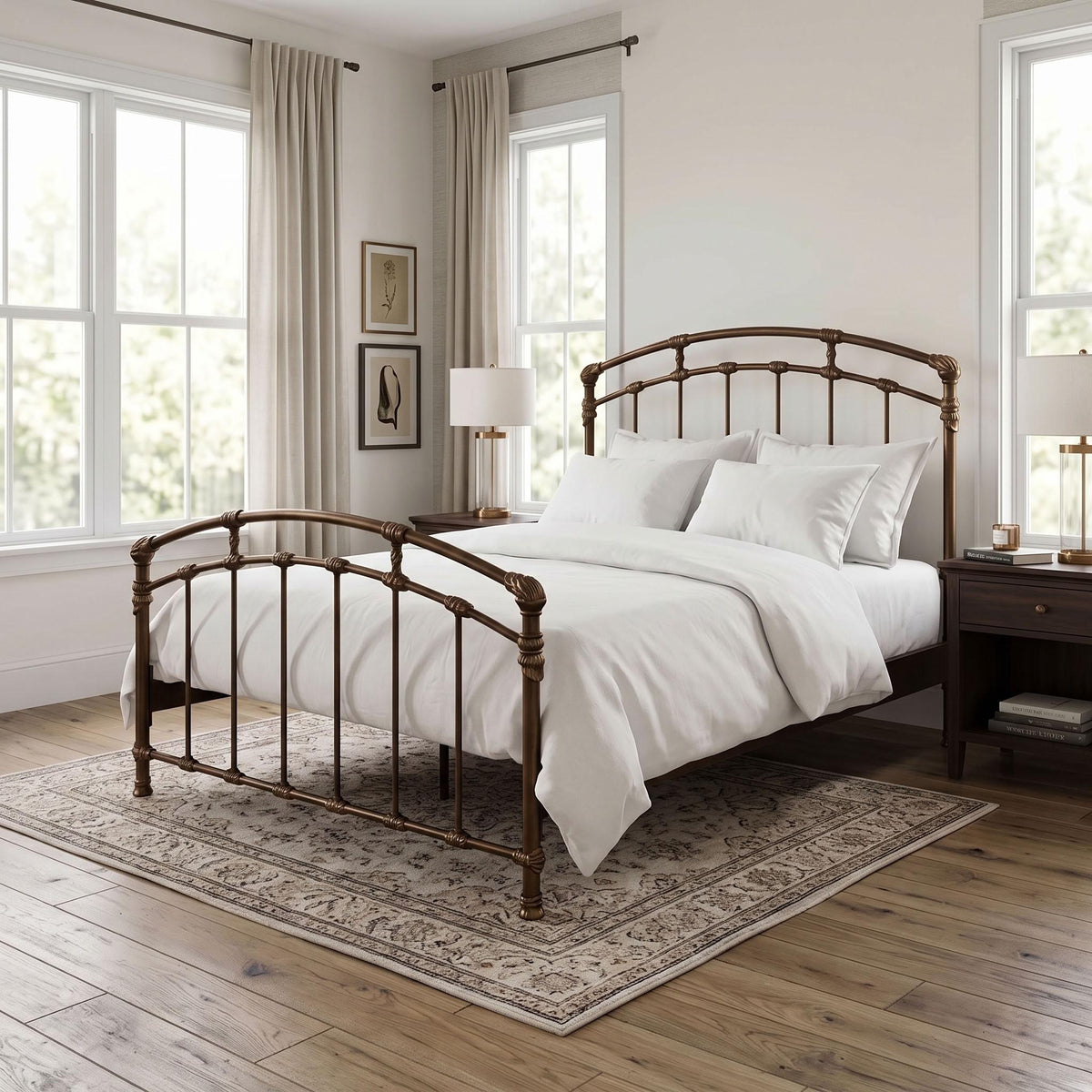 Test Iron Bed by Wesley Allen in Sun Bronze finish, Queen size, and a platform frame with wood slats. A rustic metal bed frame in a warm brown finish, styled with white bedding and pillows in a bright, modern bedroom with wood floors and large windows.