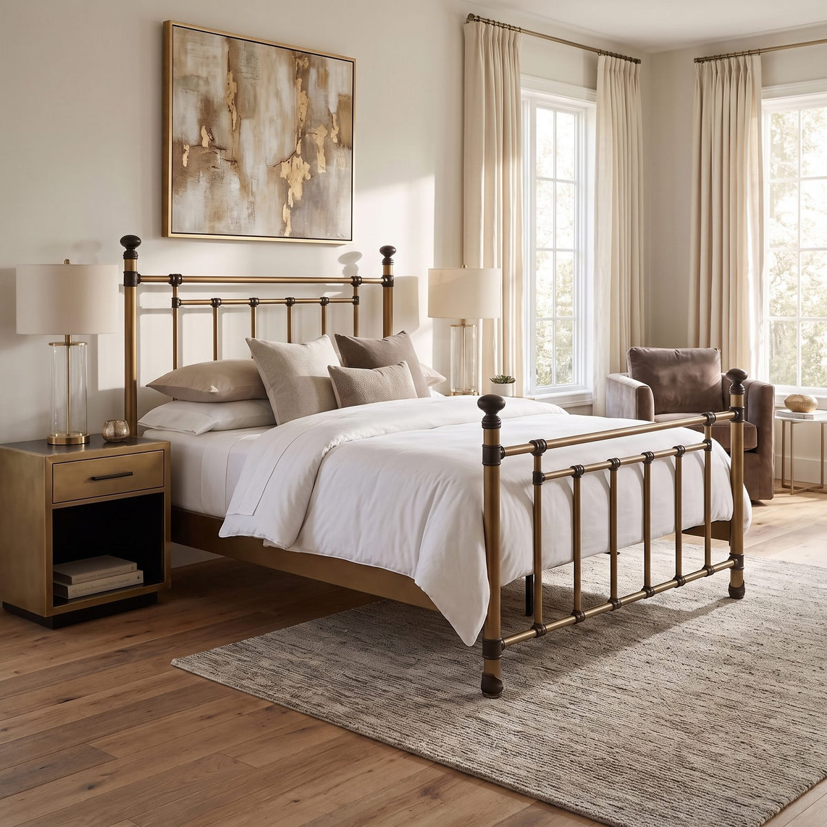 Blake iron bed 1094 in Aged Brass finish, queen size, by Wesley Allen for Matriae, styled in a warm bedroom with gold-framed art and a matching nightstand.